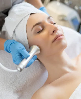 young-woman-lying-cosmetologist-s-table-rejuvenation-procedure-cosmetologist-take-care-about-neck-face-skin-youthfull-wellness-hardware-face-cleaning-procedure.jpg