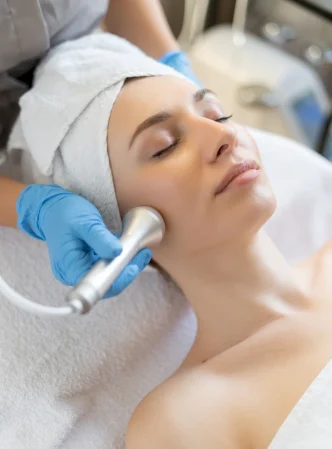 young-woman-lying-cosmetologist-s-table-rejuvenation-procedure-cosmetologist-take-care-about-neck-face-skin-youthfull-wellness-hardware-face-cleaning-procedure.jpg